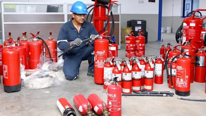 Row of serviced commercial fire extinguishers