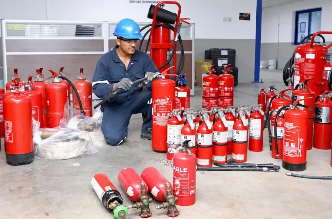 Row of serviced commercial fire extinguishers